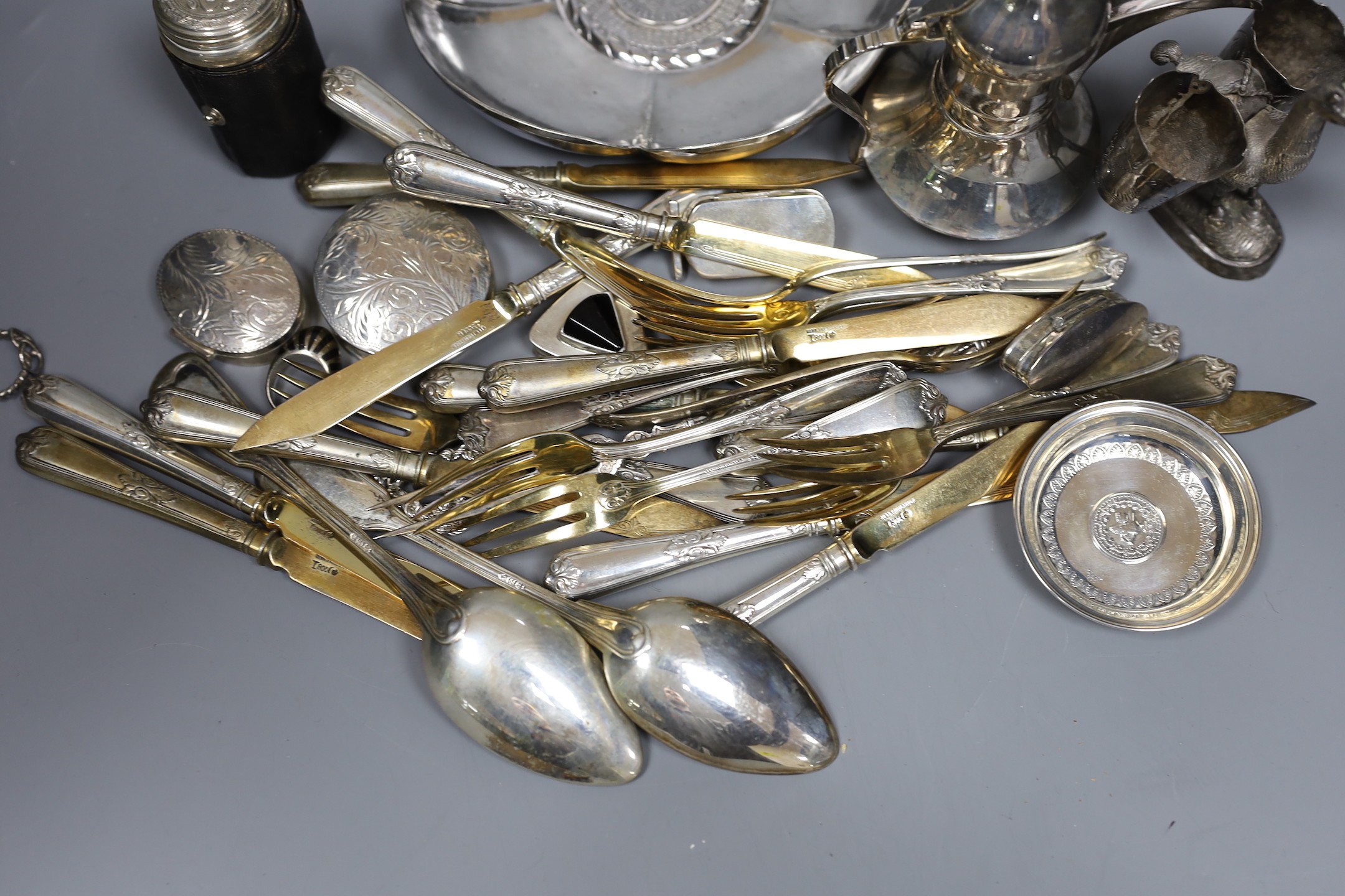A Peruvian sterling dish with inset coin, an Egyptian white metal pill box, other 925 and white metal items including flatware, ring and sterling travelling beakers.